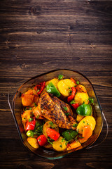 Roast chicken breast with potatoes and vegetables in pot