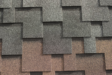 The texture of the tiled roof of the house.
