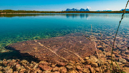 Beautiful alpine view with reflections in a lake at the famous Kitzbüheler Horn, Kitzbühel, Tyrol, Austria