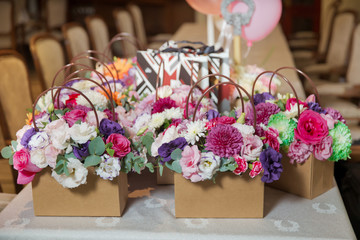Paper bouquet of fresh red, white , blue, purple roses . Paper bouquet of multicolored roses . Pink, red flower picture close up in the bouquet colorful flower bouquets on paper bouquets .