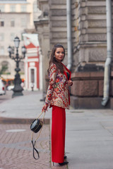 Obraz premium Woman in colorful red suit