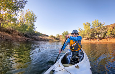 Fototapeta premium paddling expedition canoe on lake POV