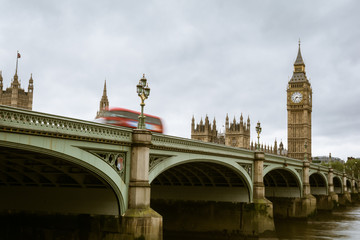 Motion blur of a red double decker bus while crossing the Westminster Bridge in London