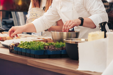 Obraz na płótnie Canvas The chef of the Swedish company prepares food
