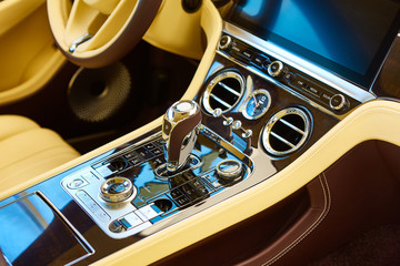 Detail of luxury car interior. Focus on gear.