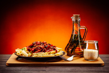 Penne with meat, tomato sauce and vegetables