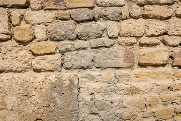 antique masonry walls with stones of various sizes in the excavation site