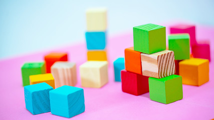 Colorful stack of wood cube building blocks