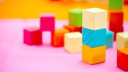 Colorful stack of wood cube building blocks