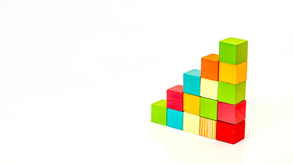 Obraz premium Colorful stack of wood cube building blocks