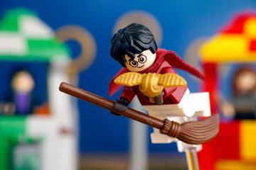 Fototapeta premium Tambov, Russian Federation - January 20, 2019 Lego Harry Potter on broom captured the Golden Snitch and win the Quidditch Match. Studio shot.