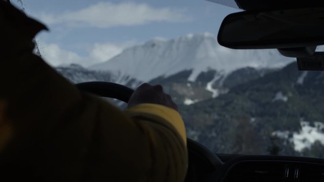 guy starting car in winter alpine landscape fiss