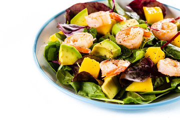 Salad with shrimps on white background