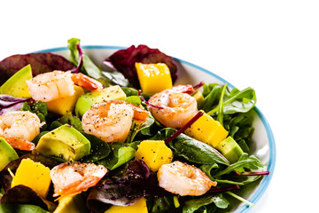 Salad with shrimps on white background
