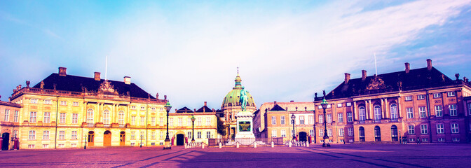 Beautiful cityscape with home residence of the Danish royal family, cathedral and monumen of Frederick V on Amalienborg Palace Square in Copenhagen, Denmark. Panorama.