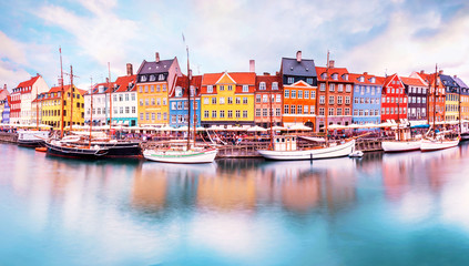 Unmatched magical fascinating landscape with boats in a famous Nyhavn in the capital of Denmark Copenhagen. Exotic amazing places. Popular tourist atraction.