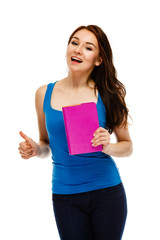 Young woman holding books on white background