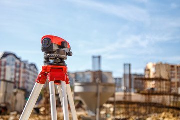 Surveyor equipment GPS system or theodolite outdoors at highway construction site.Measuring...