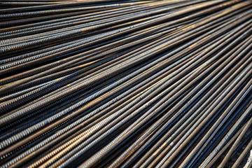 Obraz premium Industrial background. Preparation for pouring concrete. Construction of buildings of reinforced concrete.steel reinforcement bar texture in construction site,Closeup of Steel rebars