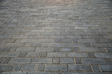 Perspective View of Monotone Gray Brick Stone on The Ground for Street Road. Sidewalk, Driveway, Pavers, Pavement in Vintage Design Ground Flooring Square Pattern Texture Background for mock up