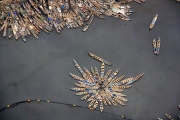 Aerial view of fishing boats moored together in the port of Tema, Greater Accra, Ghana