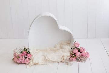 heart of wood decorated with roses. basket for newborn photo shoot. pink rose. heart