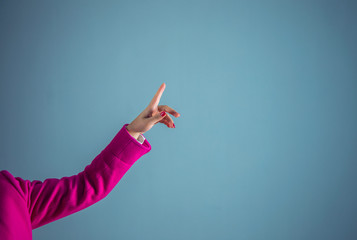 finger woman in pink suit