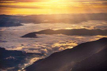 Very beautiful mountain landscape with mist rolling over the peaks