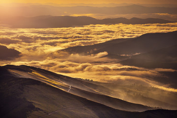 Fototapeta na wymiar Very beautiful mountain landscape with mist rolling over the peaks