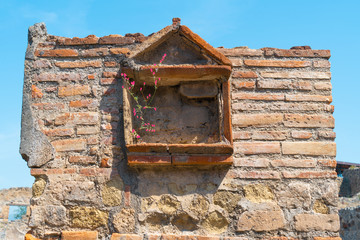 Window at Ancient ruins of Pompei city, near Napoly, Italy.