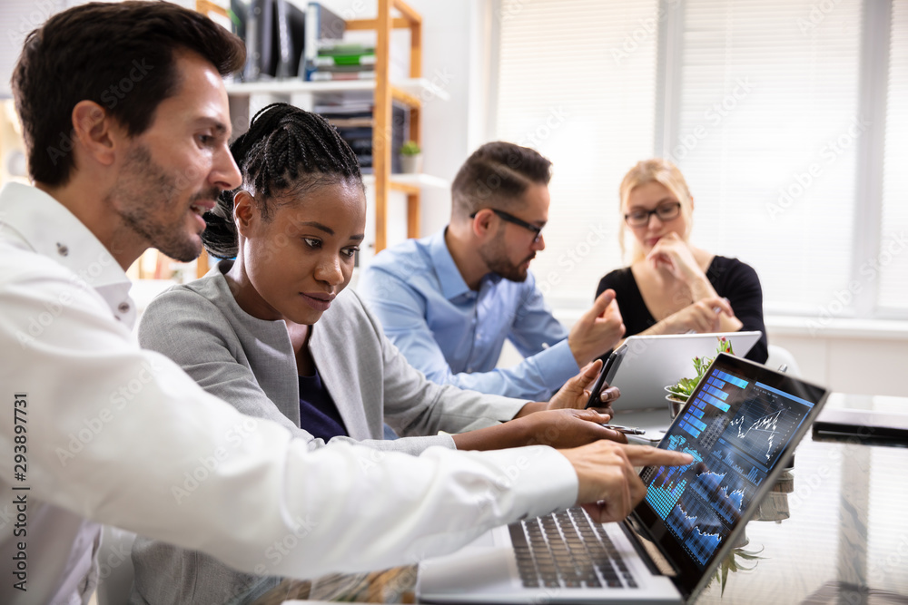 Poster Group Of Businesspeople Examining Graph On Computer