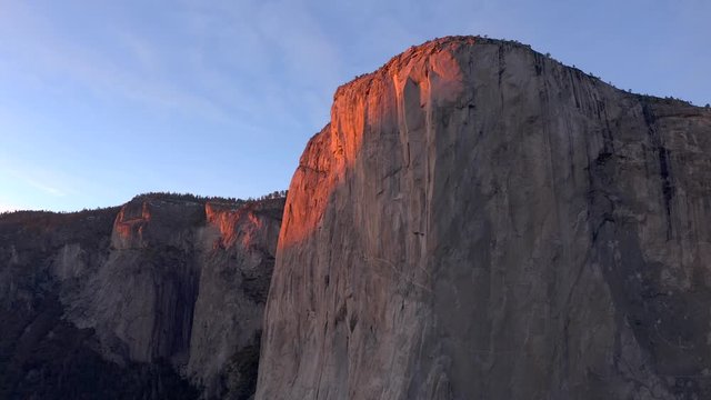 Aerial drone flight near Half Dome mountain at Yosemite National Park at sunset, 4k