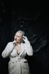 portrait of unusual girl in white clothes on black background in the Studio. woman plus size albino. concept of beauty in any person