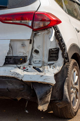 broken back of a white car close-up