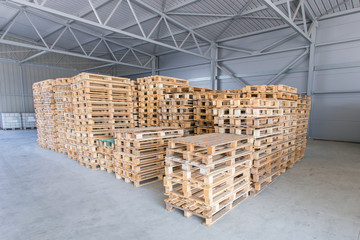 stacked wooden crated in storehouse