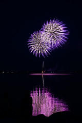 Purple fireworks over the water