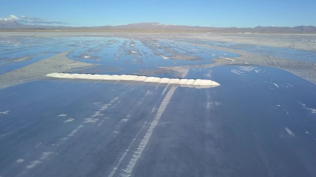 Aerial of Uyuni salt flat, the largest global reservoir of lithium. DOLLY OUT