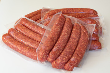 Farmers sausage in plastic wrapping