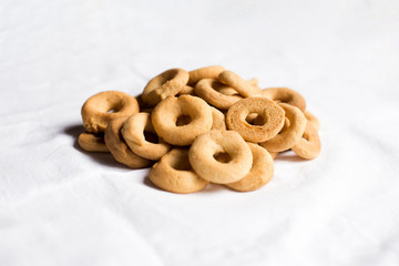 Traditional nicaraguan rosquillas de queso on a white tablecloth. No people.