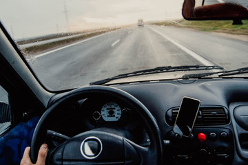 Obraz premium Driving a car on a sunny day. Business trip rain 