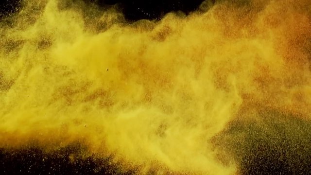 Exotic Spices paprika and curry collide on black background closeup in super slow motion