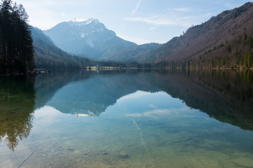 Scenic view of the great landscape reflecting on the shallow crystal clear water of the Vorderer Langbathsee near Ebensee, Oberösterreich, Austria