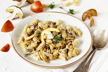 Fusilli paste with mushrooms Amanita Caesarea and boletus mushrooms and with cream. a family of fly-agarics of the highest category, a delicious mushroom. Italian Cuisine.