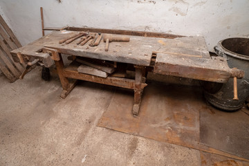 Traditional old workbench of a carpenter in his workshop in the Alpine region in Austria