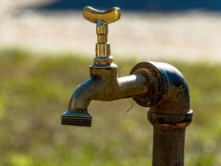old chrome tap, with selective focus.