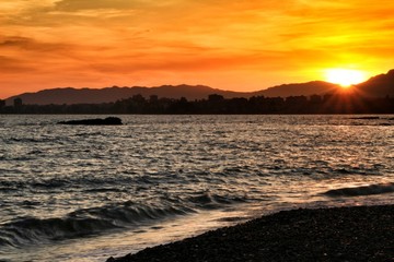 Obraz premium Sunset on Isla Plana beach in Cartagena, Murcia
