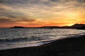 Fototapeta premium Sunset on Isla Plana beach in Cartagena, Murcia