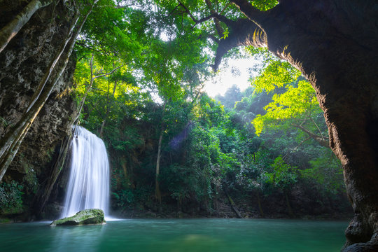 Erawan waterfall and national park which is one of famous travel destination in Kanchanaburi - Thailand. Photo contain ghost-flare due to sunlight. Long exposure shutter, for smooth water. 