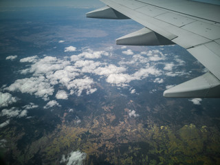 Obraz premium cloudscape land aerial view from airplane