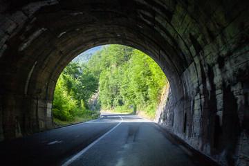 Fototapeta na wymiar Traffic Tunnel Exit On Beautiful Mountain Road
